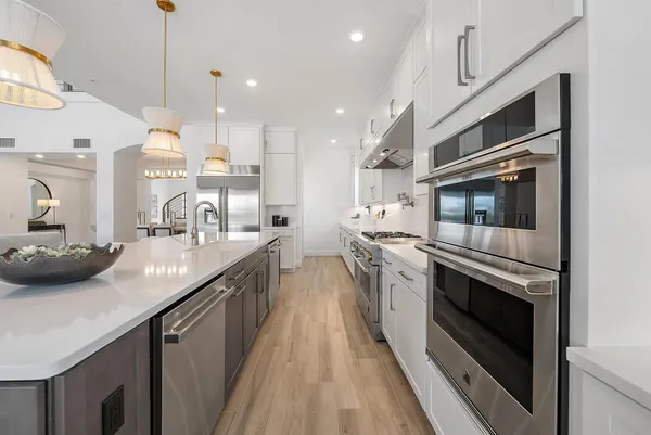 a view of kitchen island with wooden floor