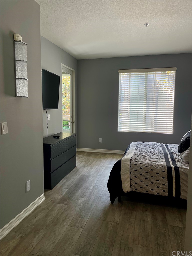 2233 Martin, Unit 108 Irvine, CA 92612 - Photo 13 of 30 master bedroom with direct access to balcony