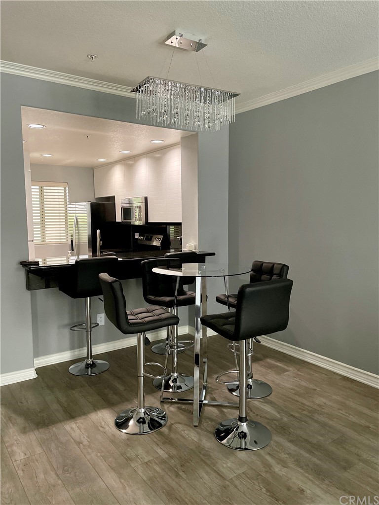 2233 Martin, Unit 108 Irvine, CA 92612 - Photo 9 of 30 Dining Area with Elegant lighting