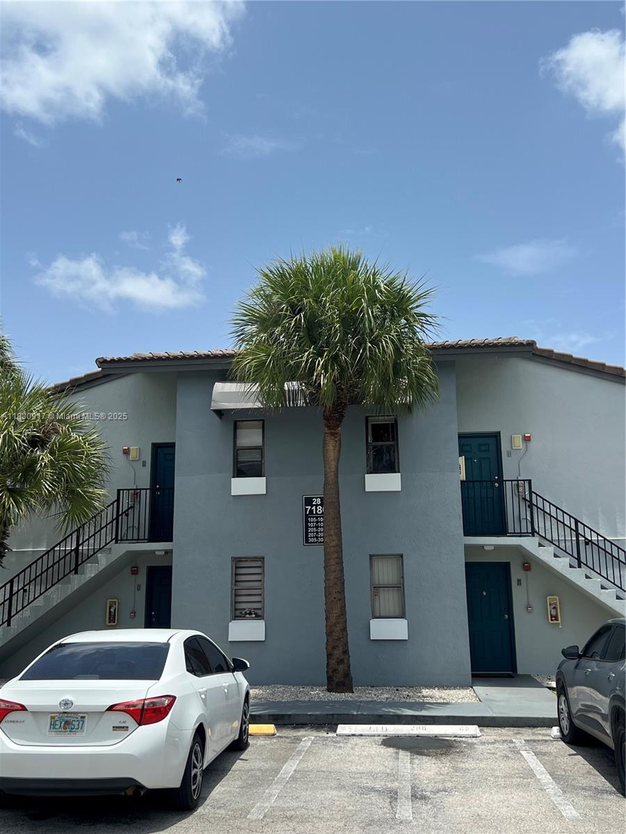 7180 Northwest 179th Street, Unit 109 Hialeah, FL 33015 - Photo 15 of 17 a view of a patio with couches and potted plants