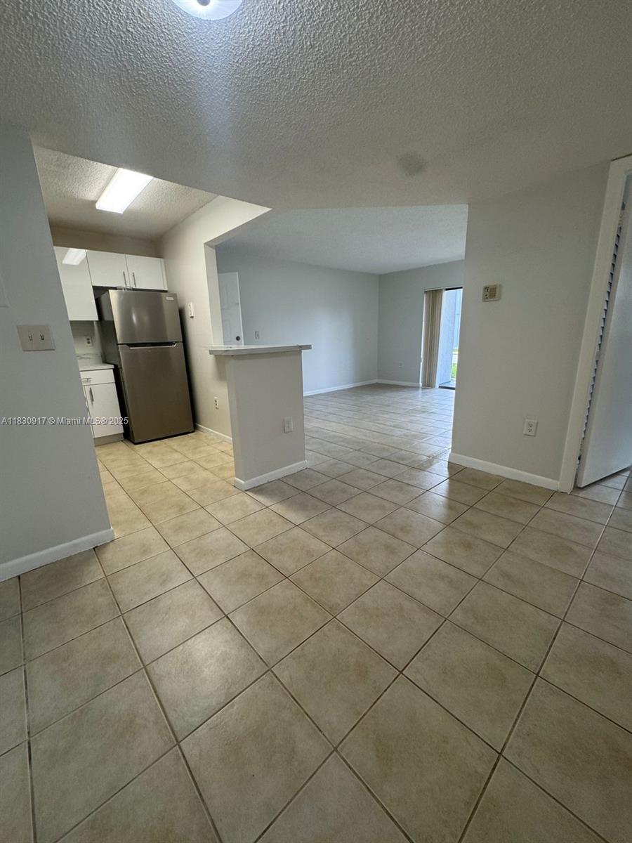 7180 Northwest 179th Street, Unit 109 Hialeah, FL 33015 - Photo 5 of 17 a view of a storage & utility room
