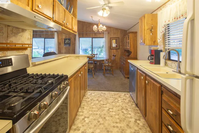 a spacious bathroom with a granite countertop sink and a large mirror