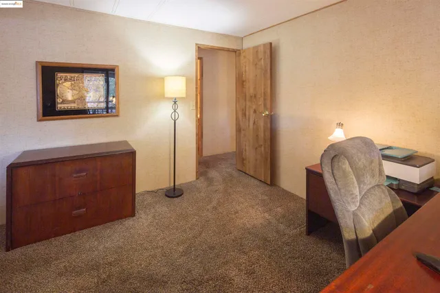 a livingroom with furniture and a window