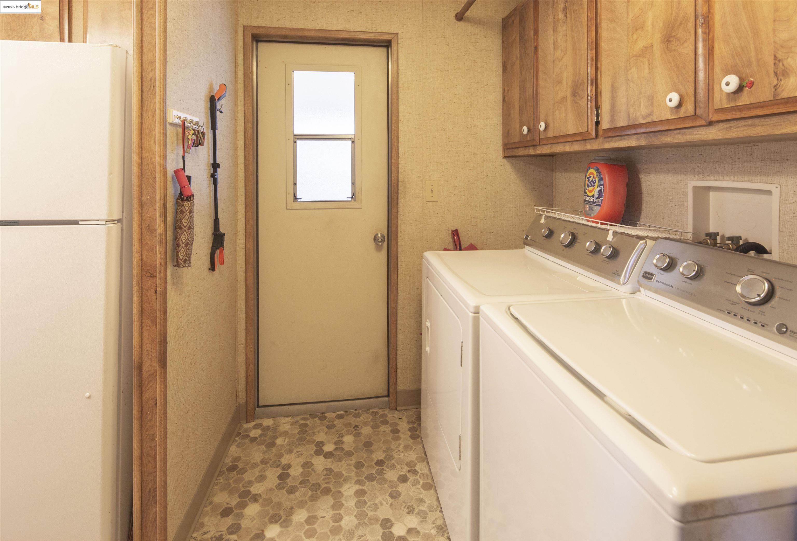 18717 Mill Villa Road, Unit 156 Jamestown, CA 95327 - Photo 25 of 40 Laundry area with separate washer and dryer and cabinet space
