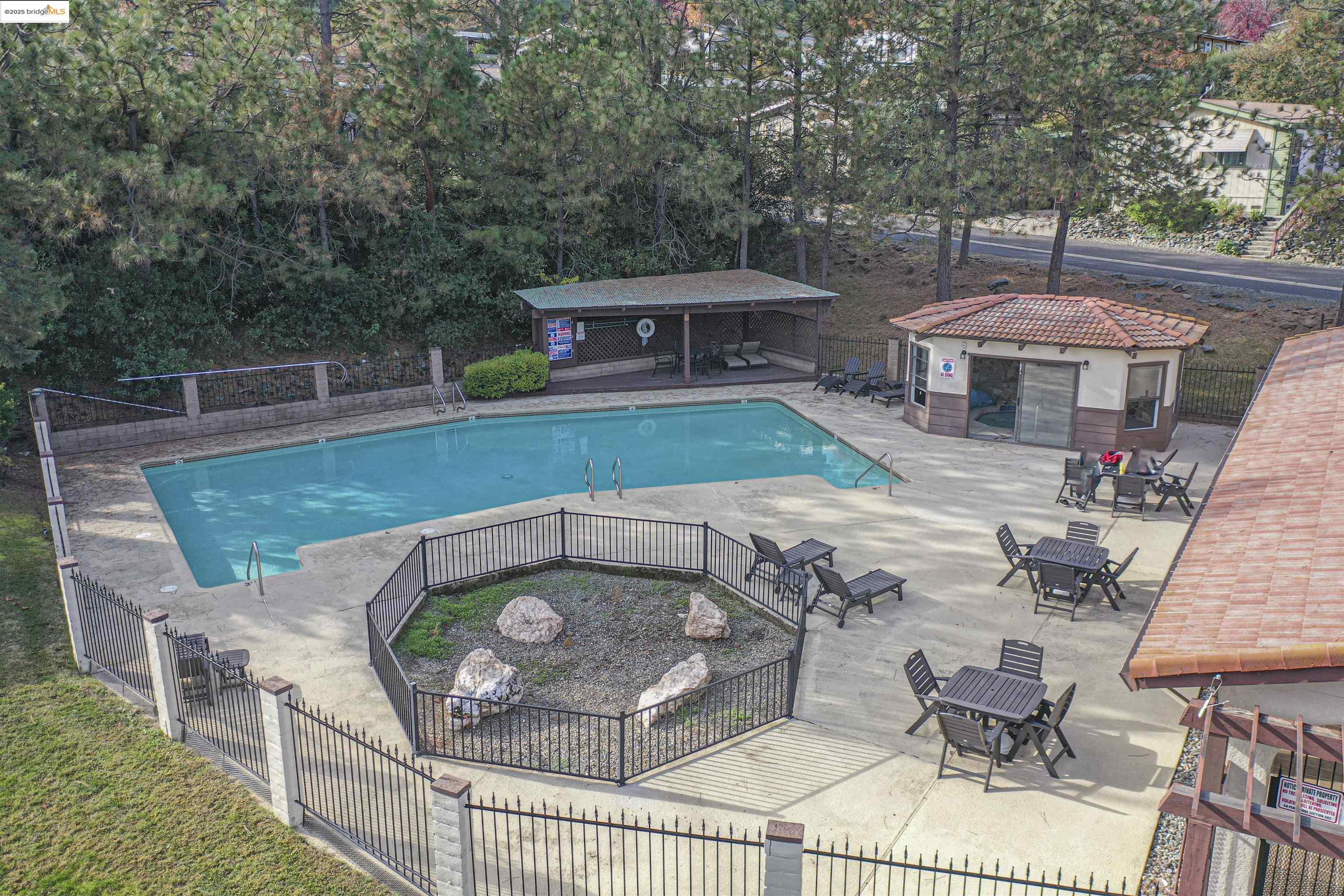 18717 Mill Villa Road, Unit 156 Jamestown, CA 95327 - Photo 26 of 40 Community pool featuring a patio, an outbuilding, view of scattered trees, and outdoor dining area