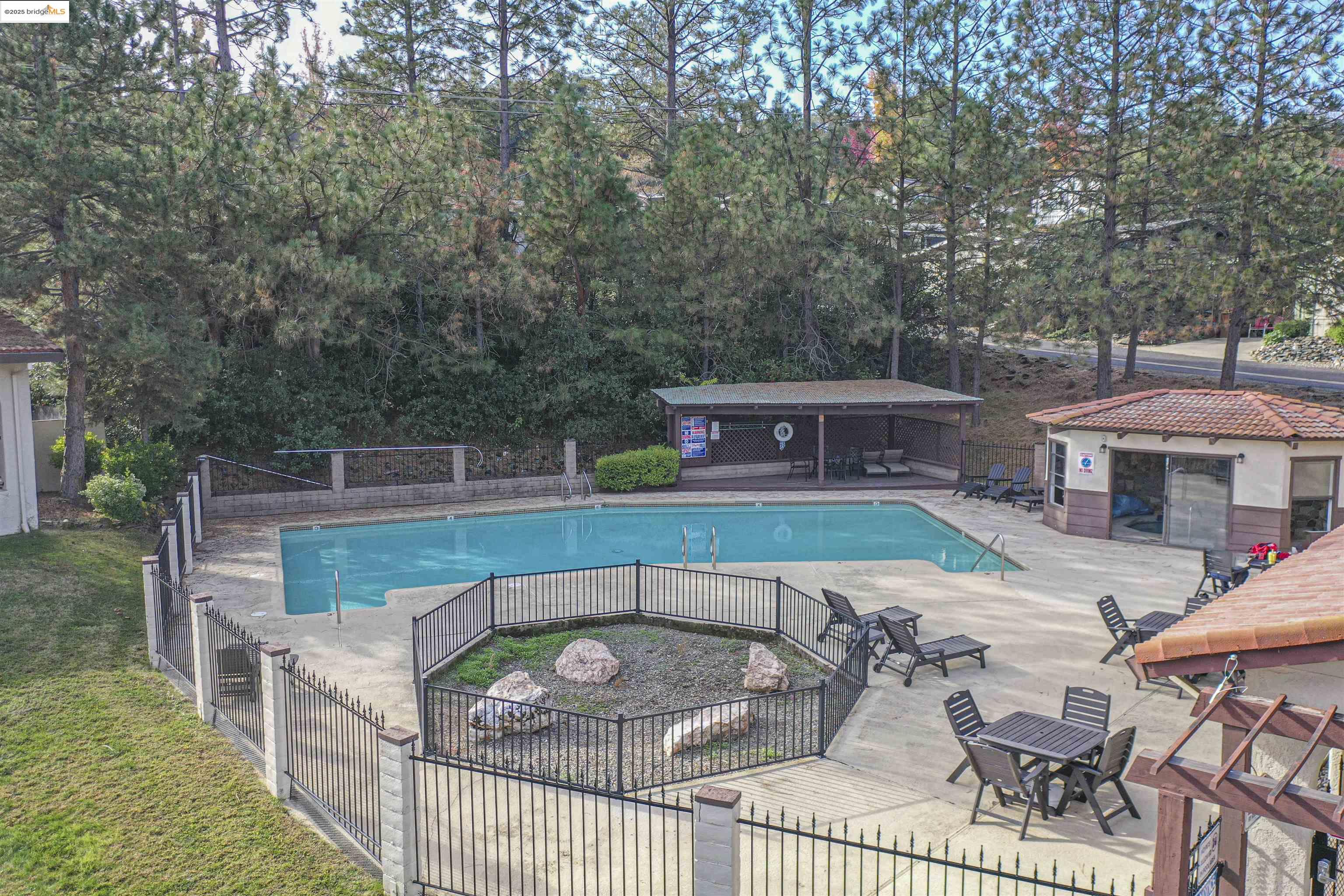 18717 Mill Villa Road, Unit 156 Jamestown, CA 95327 - Photo 27 of 40 Community pool featuring a patio area and view of scattered trees