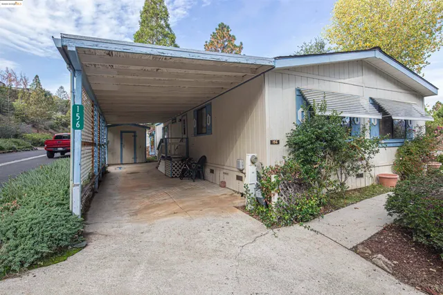 a view of a chairs and table in the backyard