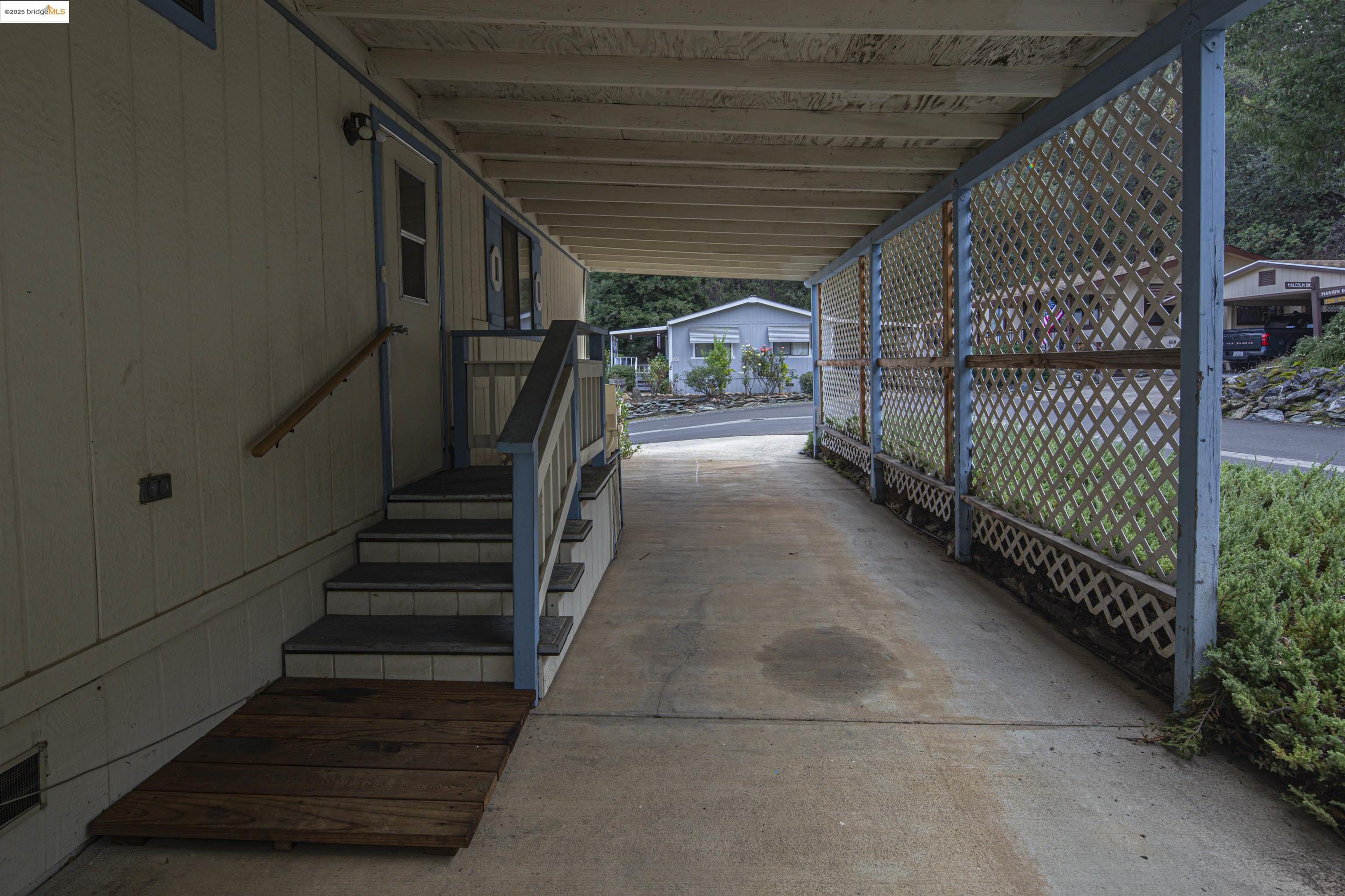 18717 Mill Villa Road, Unit 156 Jamestown, CA 95327 - Photo 36 of 40 Covered porch featuring an outdoor structure