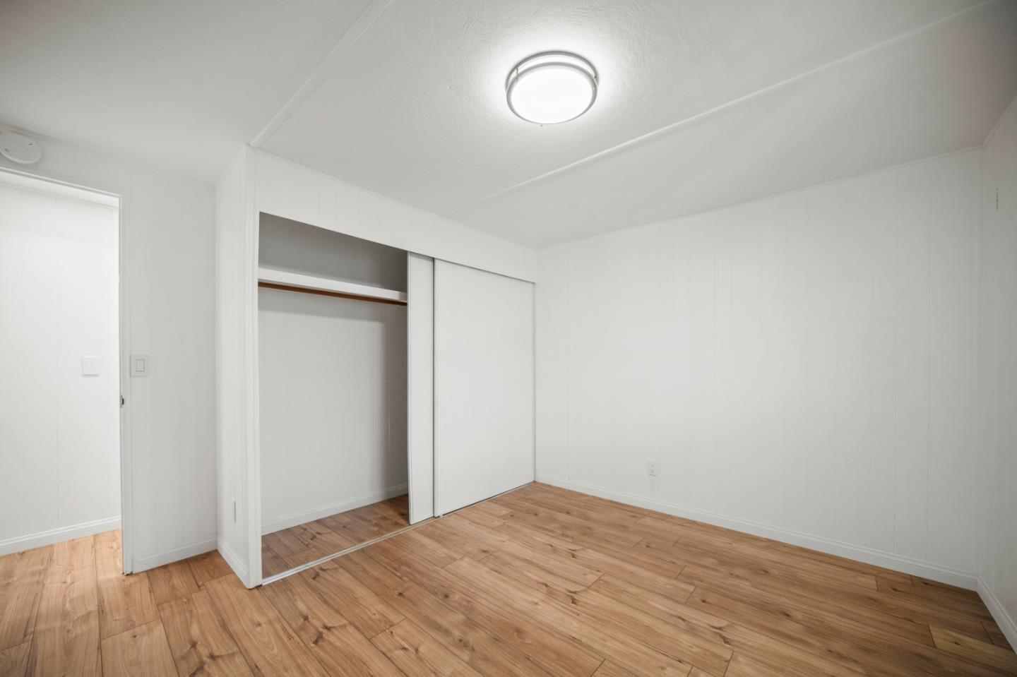 55 San Juan Grade Road, Unit 63 Salinas, CA 93906 - Photo 11 of 37 a view of empty room with wooden floor