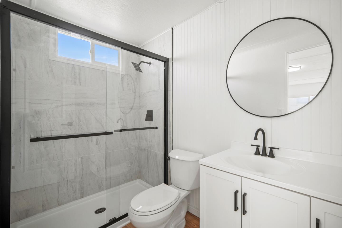 55 San Juan Grade Road, Unit 63 Salinas, CA 93906 - Photo 12 of 37 a bathroom with a sink a mirror a toilet and shower