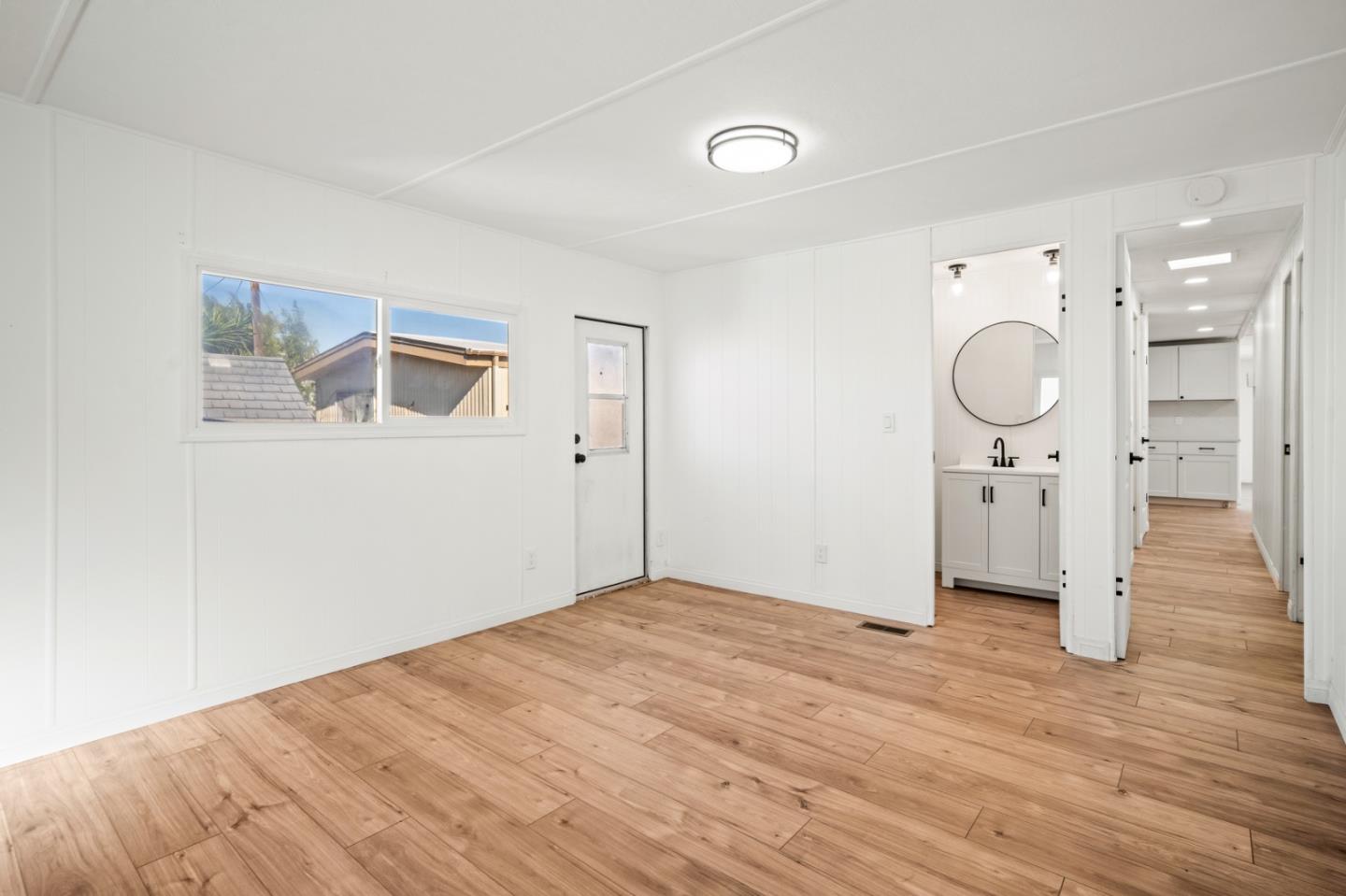 55 San Juan Grade Road, Unit 63 Salinas, CA 93906 - Photo 13 of 37 a view of a room with wooden floor and window