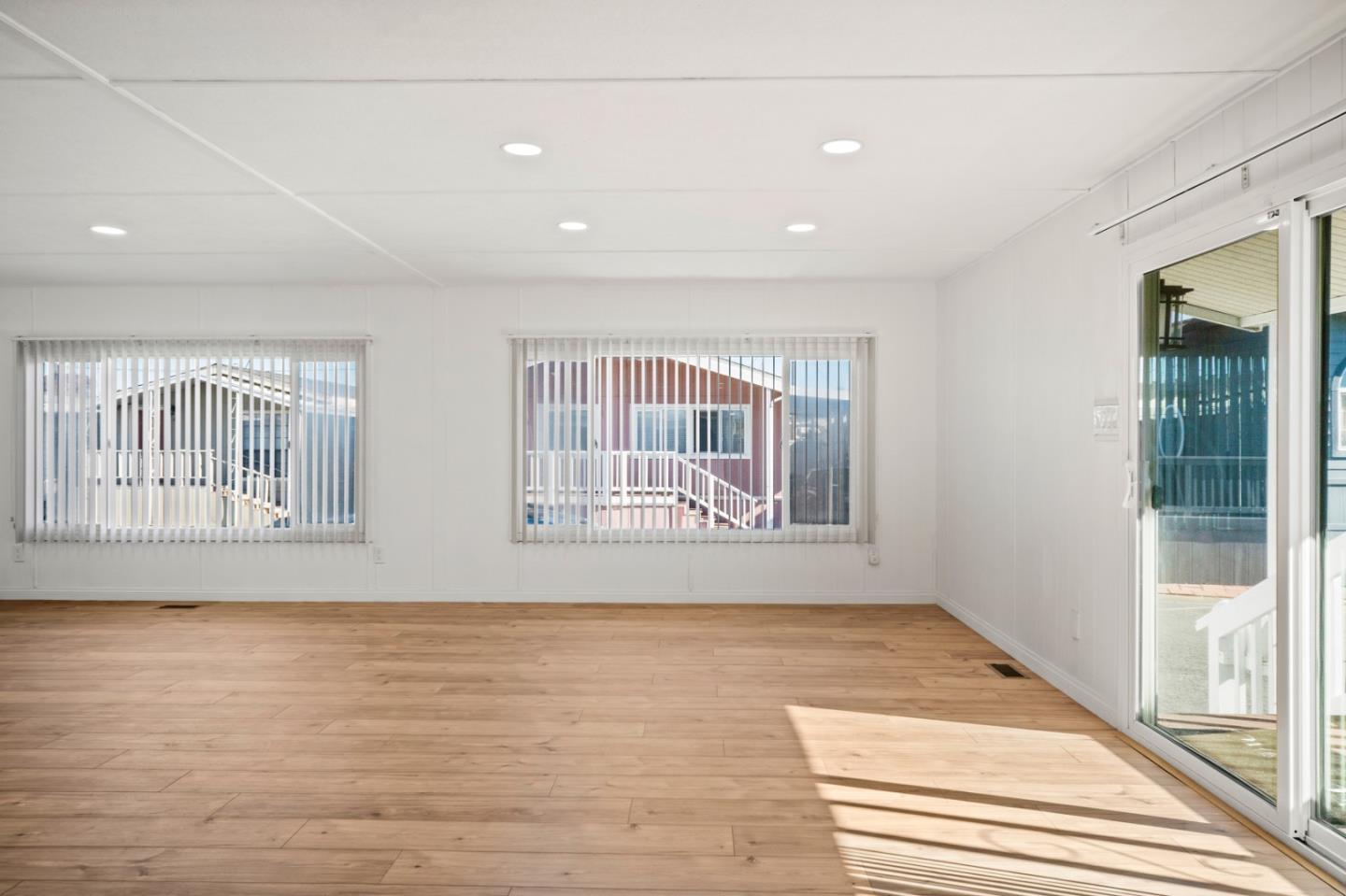 55 San Juan Grade Road, Unit 63 Salinas, CA 93906 - Photo 26 of 37 a view of an empty room with wooden floor and a window