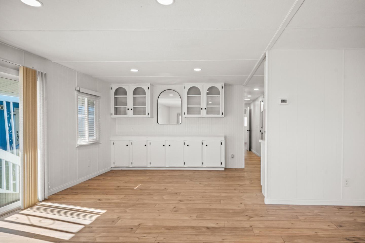 55 San Juan Grade Road, Unit 63 Salinas, CA 93906 - Photo 27 of 37 an empty room with wooden floor and windows