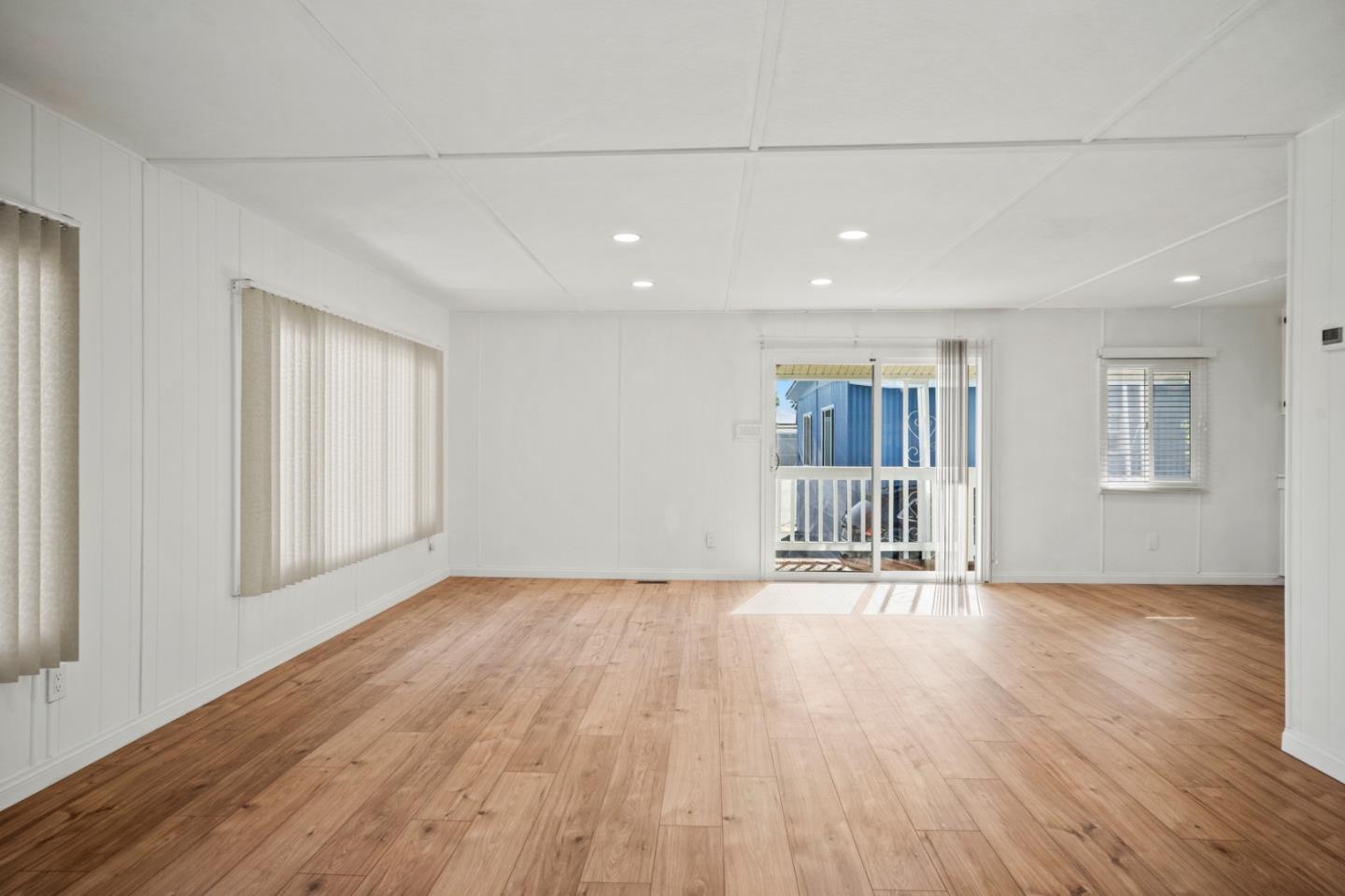 55 San Juan Grade Road, Unit 63 Salinas, CA 93906 - Photo 30 of 37 a view of an empty room with wooden floor and a window