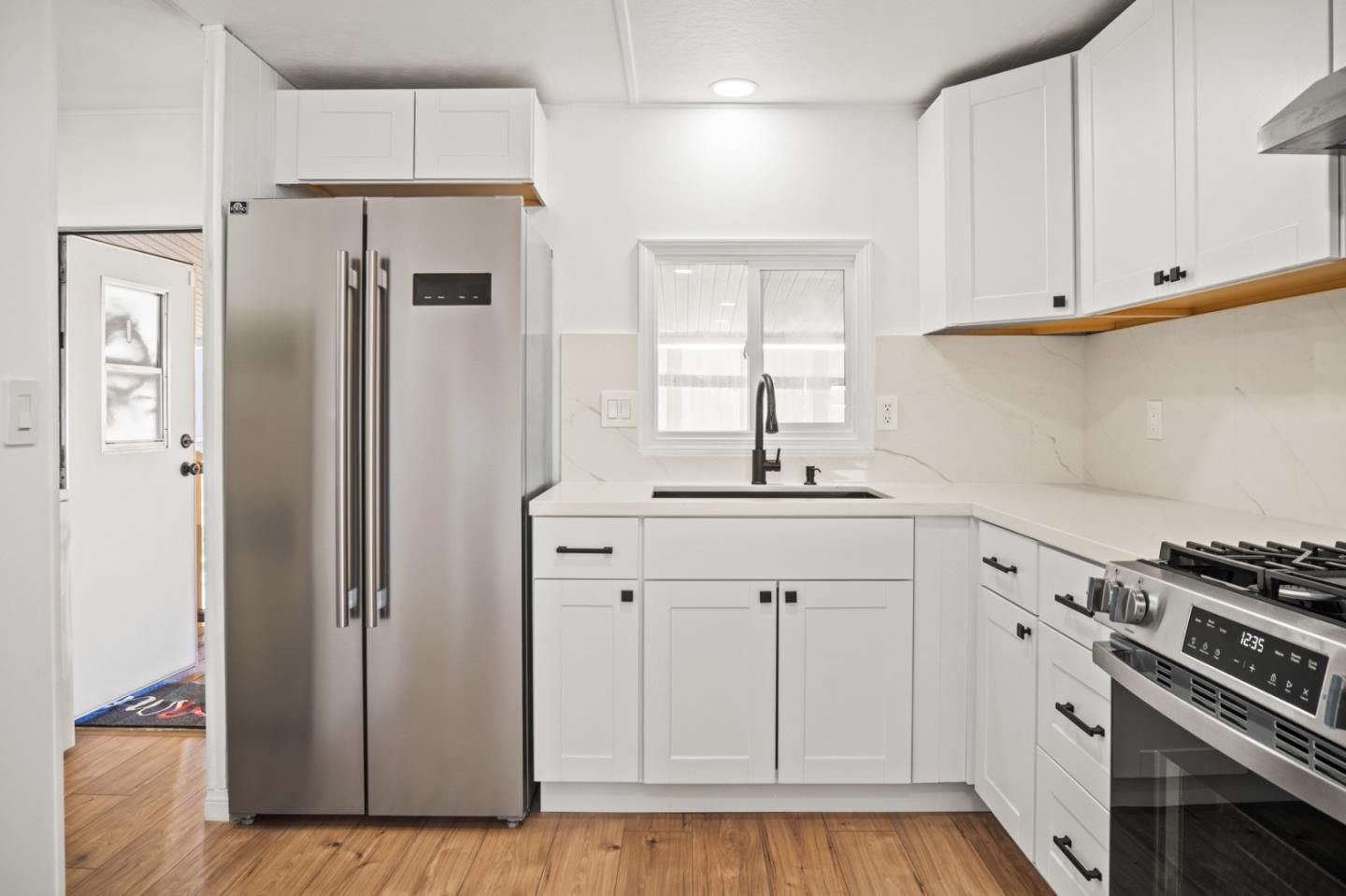 55 San Juan Grade Road, Unit 63 Salinas, CA 93906 - Photo 6 of 37 a kitchen with white cabinets and white appliances