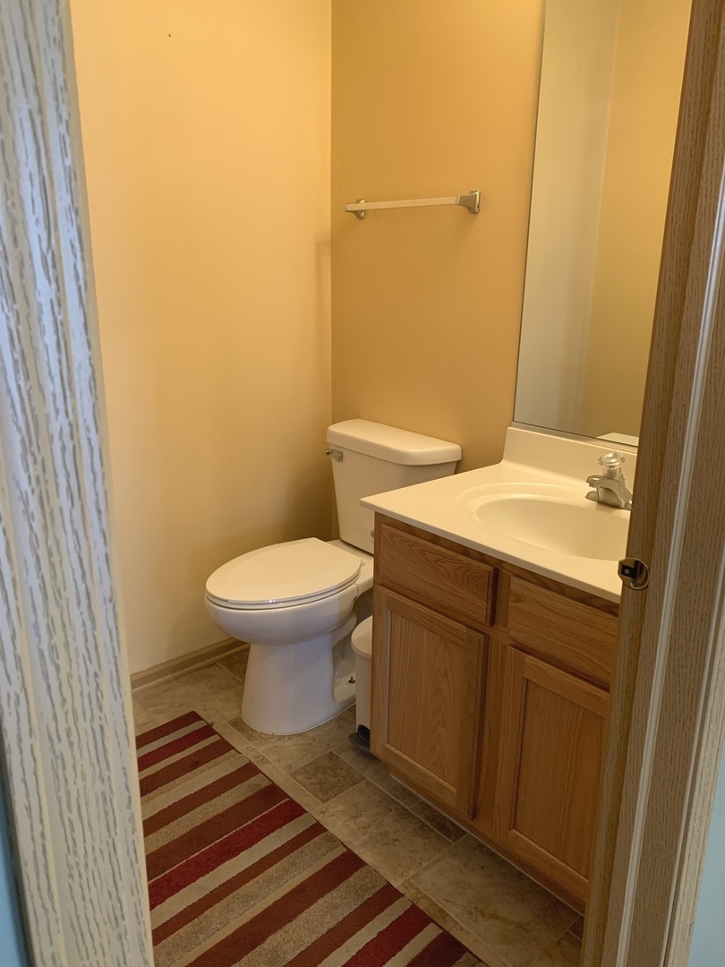 1944 Crestview Circle Romeoville, IL 60446 - Photo 14 of 35 a bathroom with a sink and a toilet