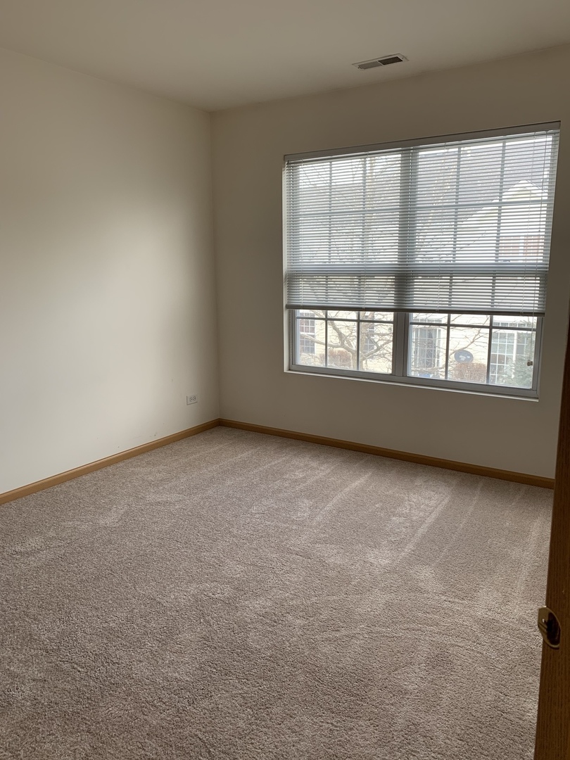 1944 Crestview Circle Romeoville, IL 60446 - Photo 22 of 35 an empty room with a window