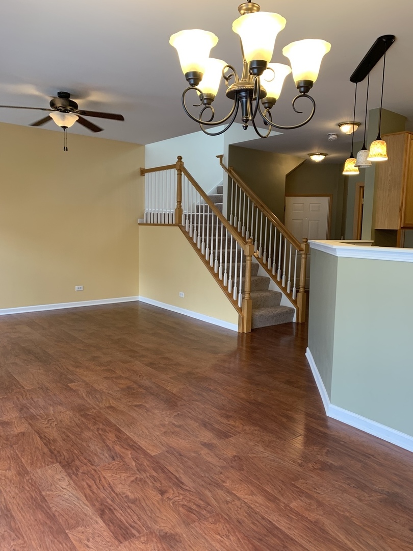 1944 Crestview Circle Romeoville, IL 60446 - Photo 8 of 35 a view of entryway and hall with wooden floor