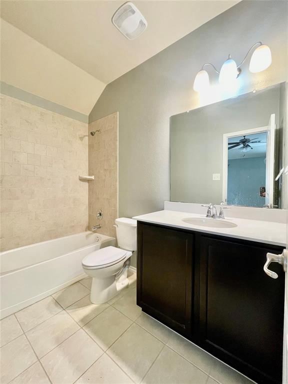 1005 Lake Woodland Drive Little Elm, TX 75068 - Photo 14 of 37 Bathroom featuring light tile patterned flooring, vanity, shower / bathtub combination, vaulted ceiling, and ceiling fan