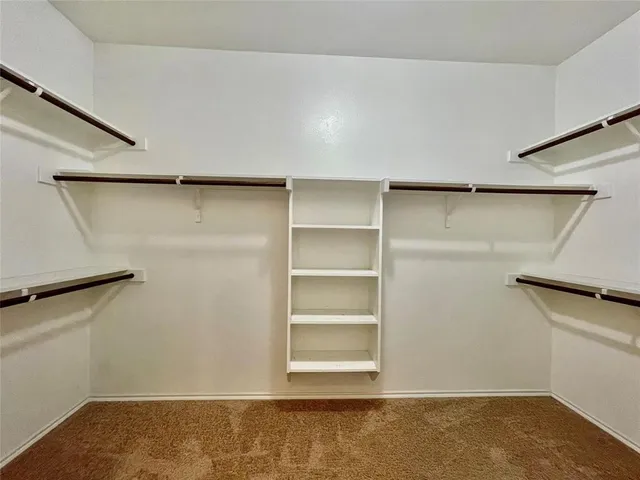 a room with a wooden shelves