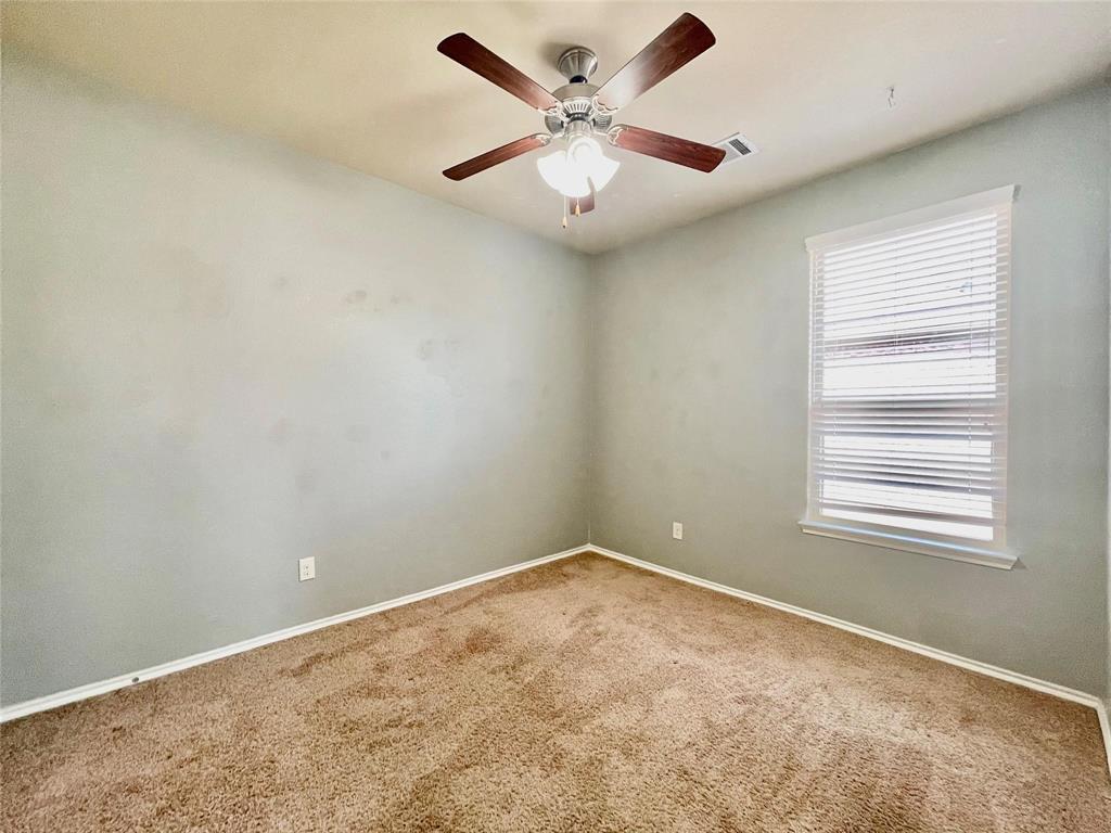 1005 Lake Woodland Drive Little Elm, TX 75068 - Photo 24 of 37 Carpeted empty room with baseboards and ceiling fan