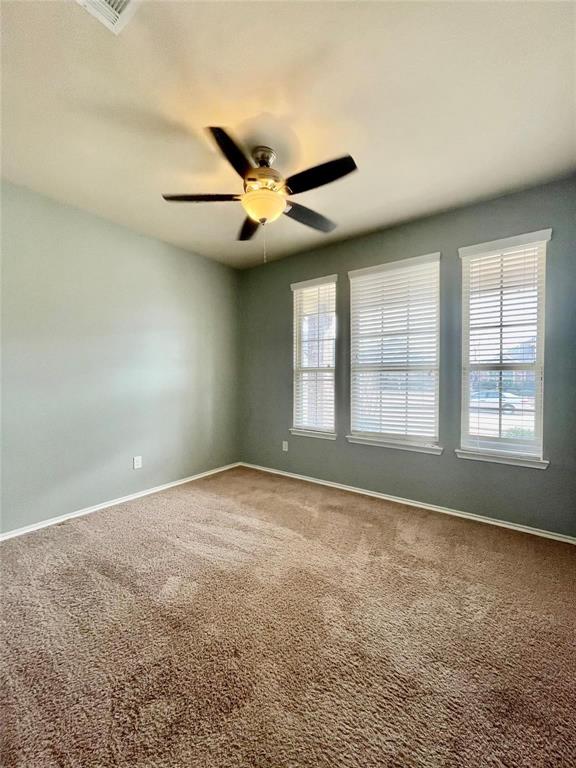 1005 Lake Woodland Drive Little Elm, TX 75068 - Photo 28 of 37 Empty room with carpet floors and a ceiling fan