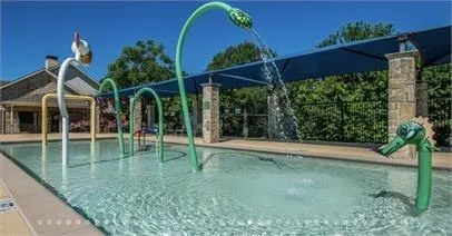 a view of a house with backyard and porch