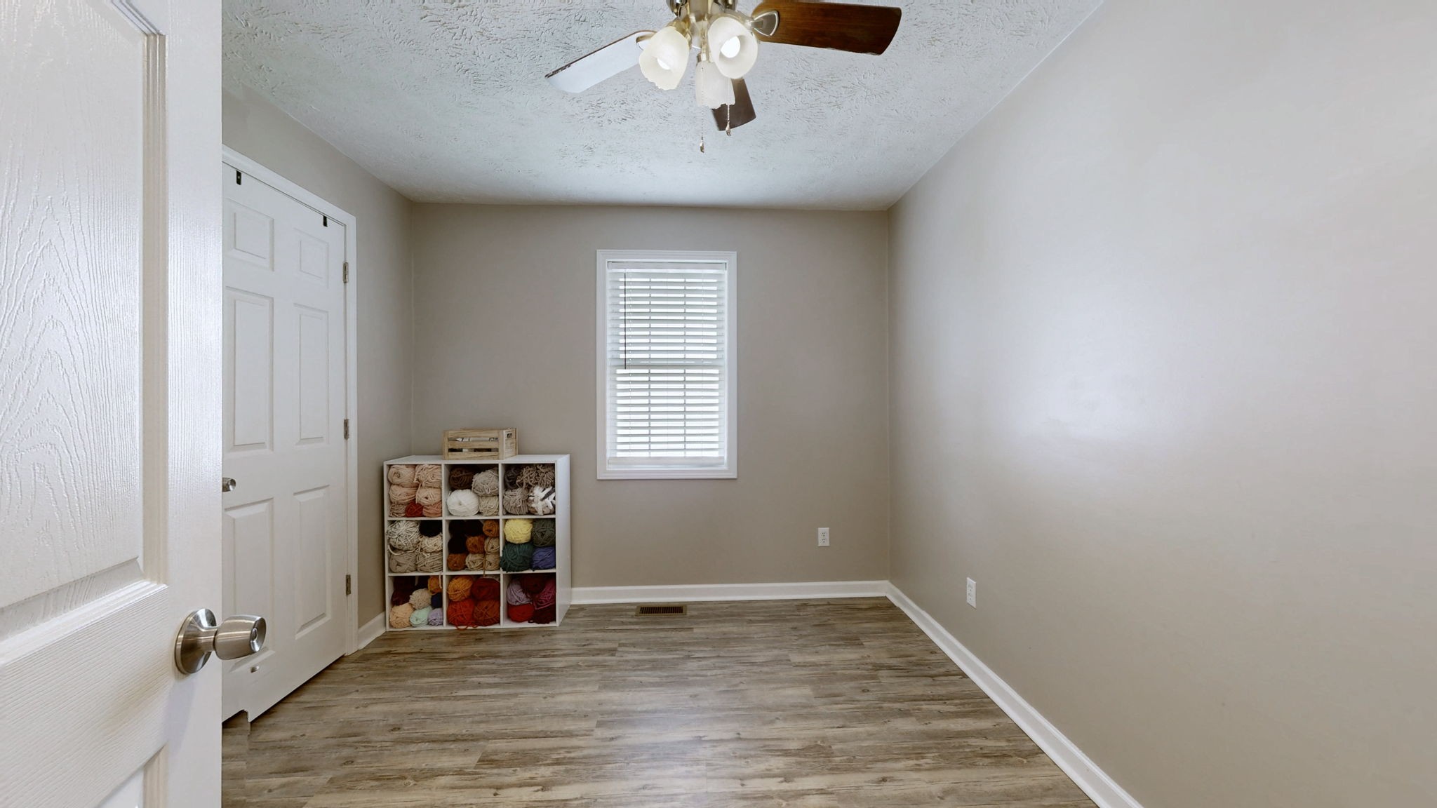 904 West Market Street Decherd, TN 37324 - Photo 14 of 26 wooden floor in an empty room with a window