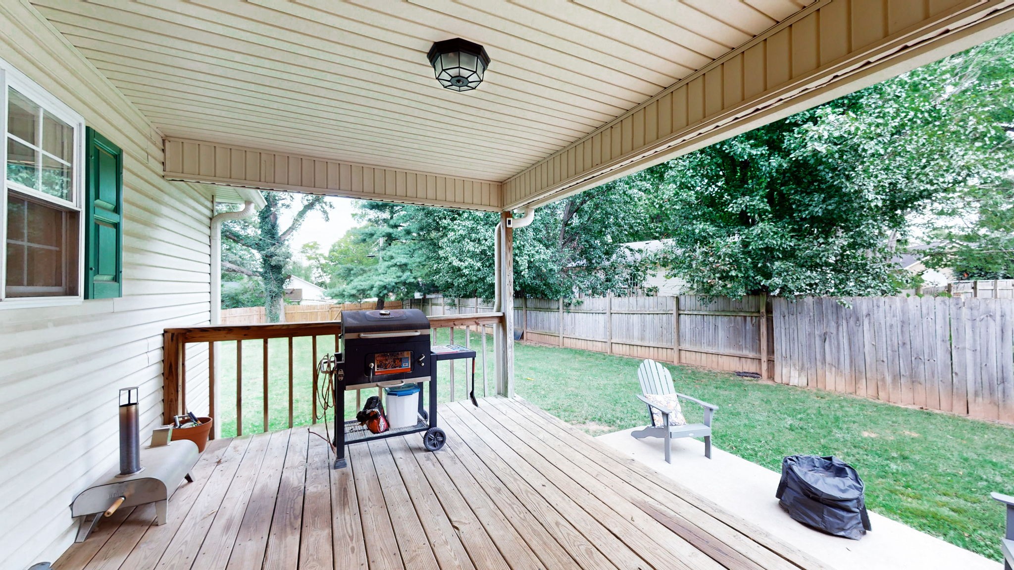 904 West Market Street Decherd, TN 37324 - Photo 16 of 26 a view of a deck with a table chairs and a backyard