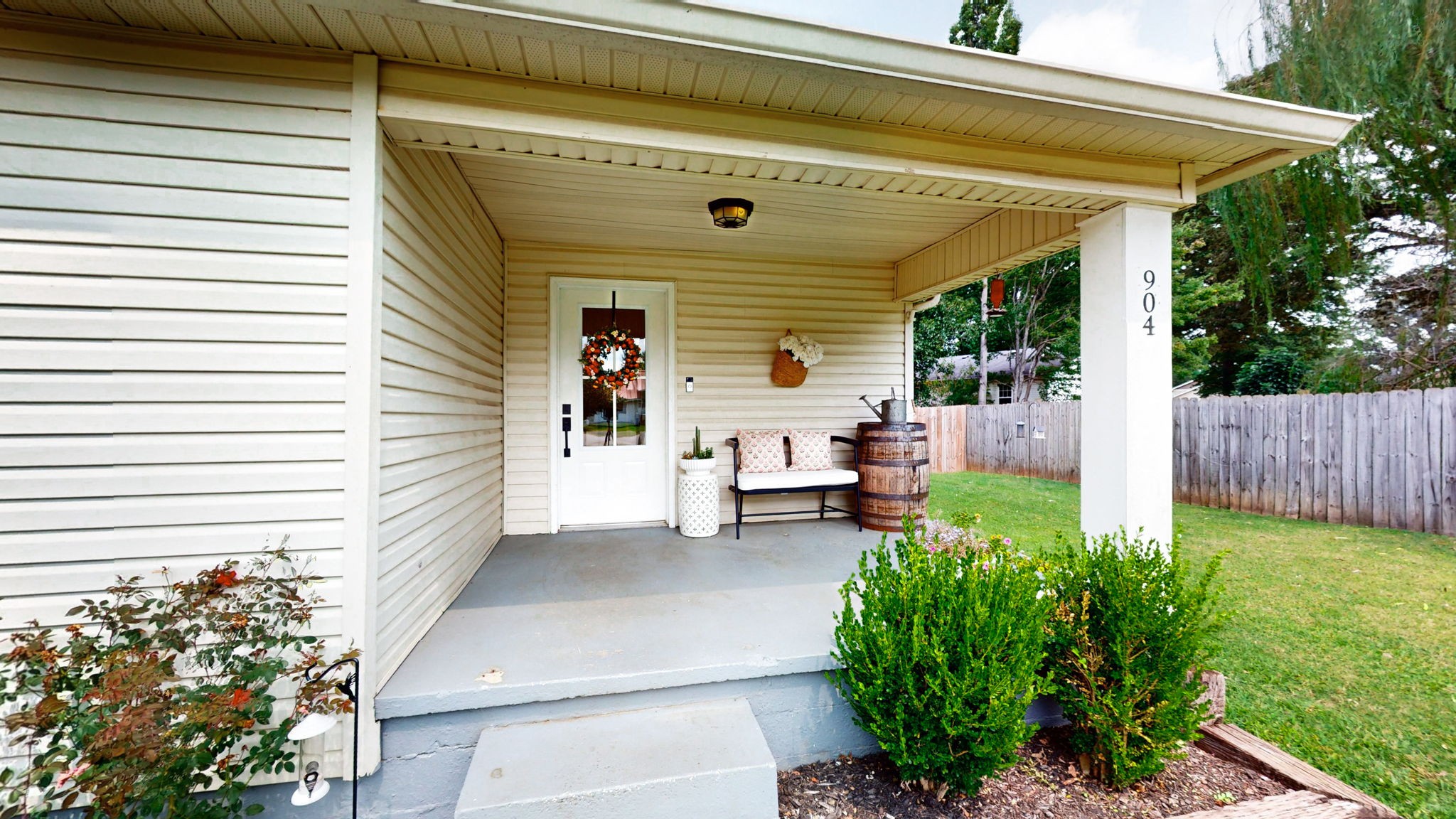 904 West Market Street Decherd, TN 37324 - Photo 2 of 26 a view of a chair and table in backyard of the house