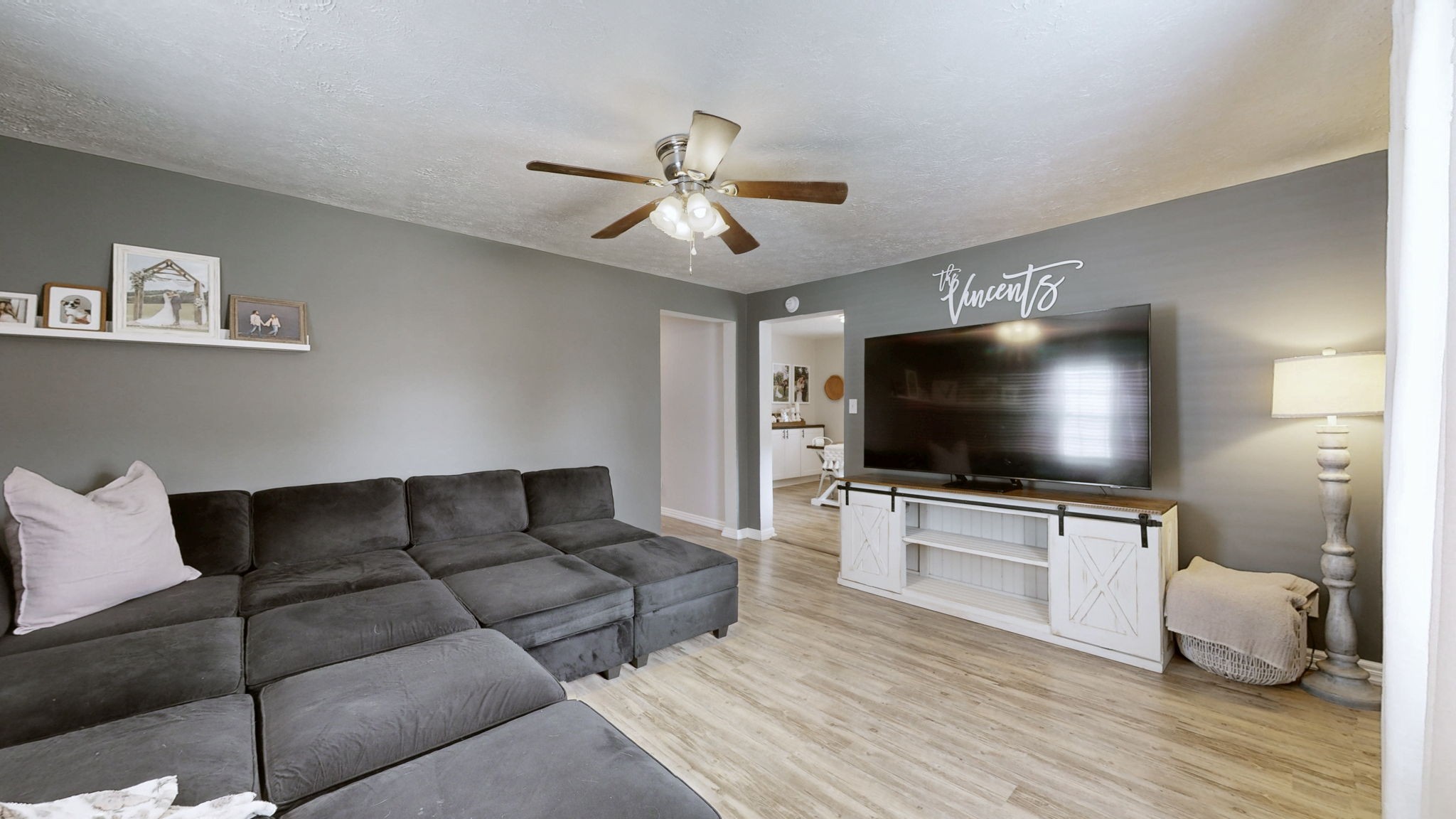 904 West Market Street Decherd, TN 37324 - Photo 6 of 26 a living room with furniture and a flat screen tv