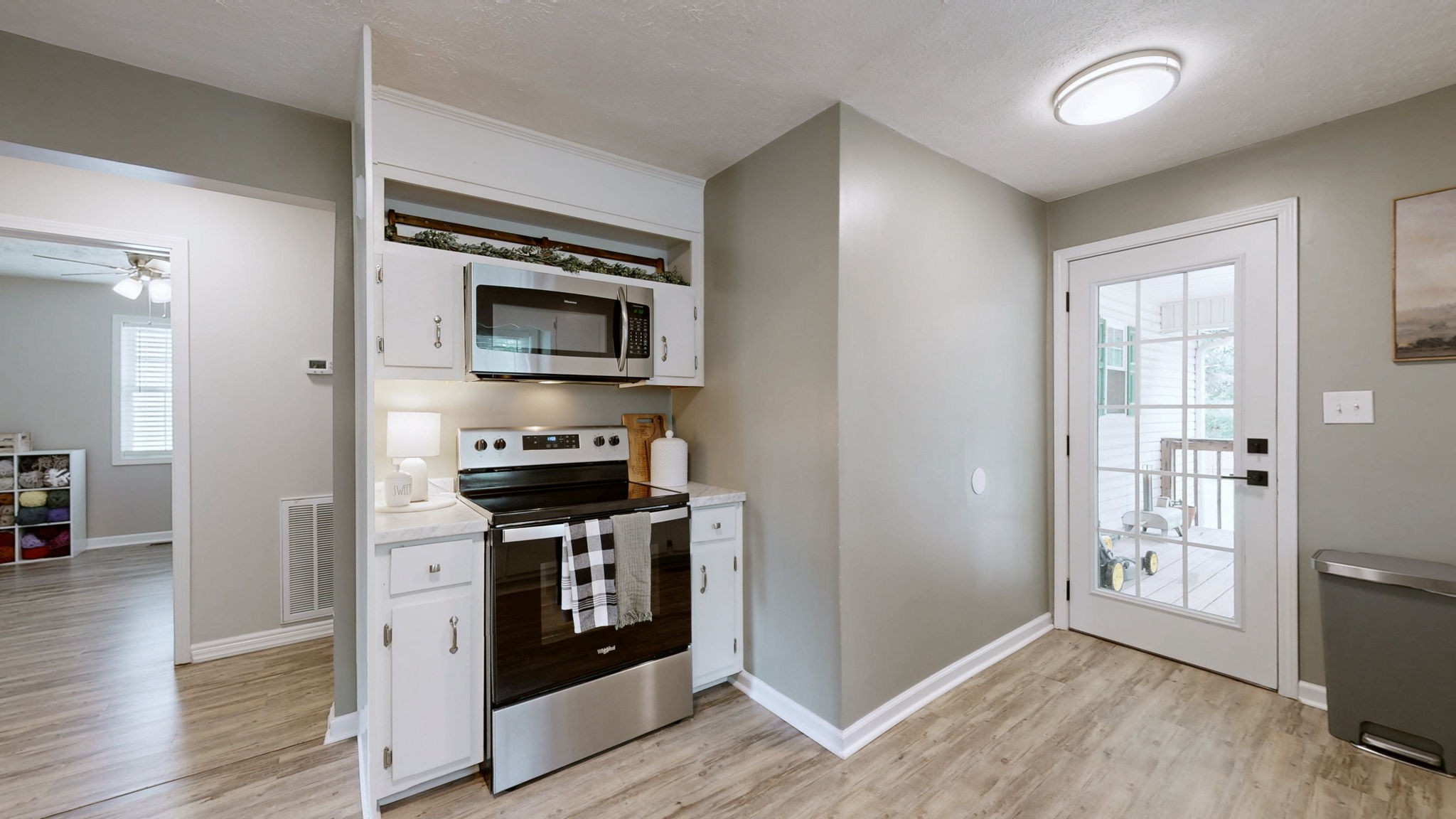 904 West Market Street Decherd, TN 37324 - Photo 8 of 26 a kitchen with stainless steel appliances granite countertop a stove and a refrigerator