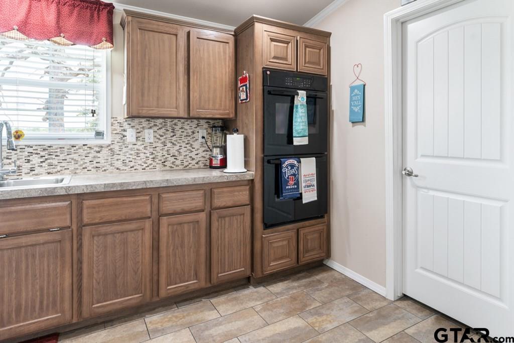 12350 County Road 2911 Eustace, TX 75124 - Photo 19 of 43 a kitchen with stainless steel appliances granite countertop a refrigerator and a sink