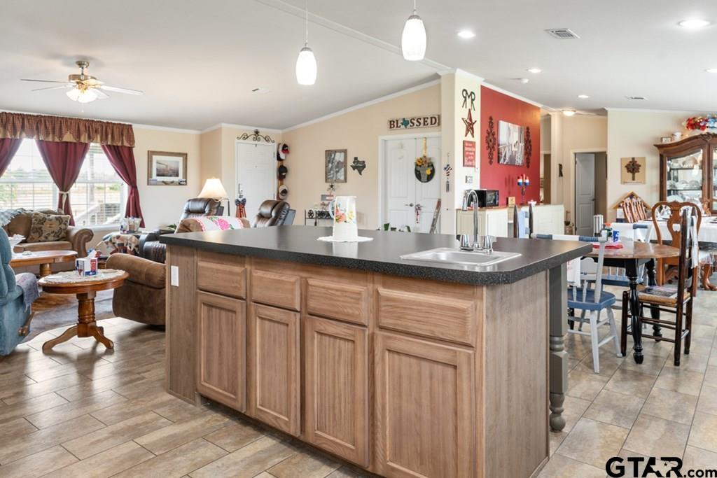 12350 County Road 2911 Eustace, TX 75124 - Photo 21 of 43 a kitchen with counter space dining table and chairs