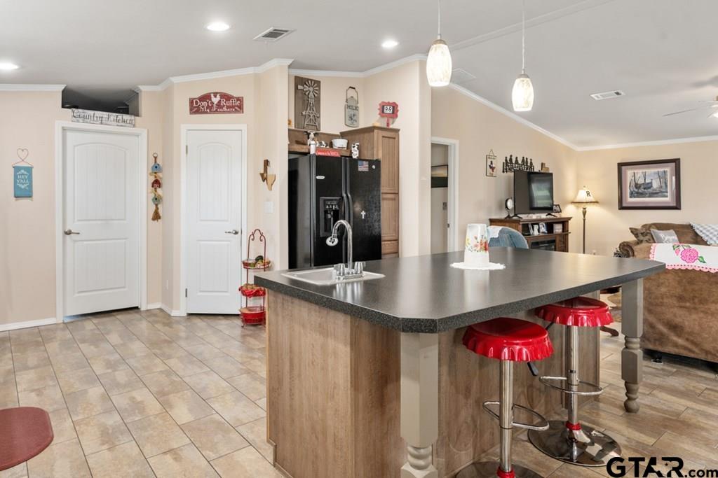 12350 County Road 2911 Eustace, TX 75124 - Photo 23 of 43 a kitchen with stainless steel appliances granite countertop a refrigerator a sink and a stove