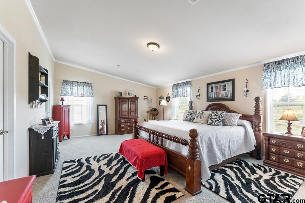 12350 County Road 2911 Eustace, TX 75124 - Photo 26 of 43 a bedroom with a bed and wooden floor