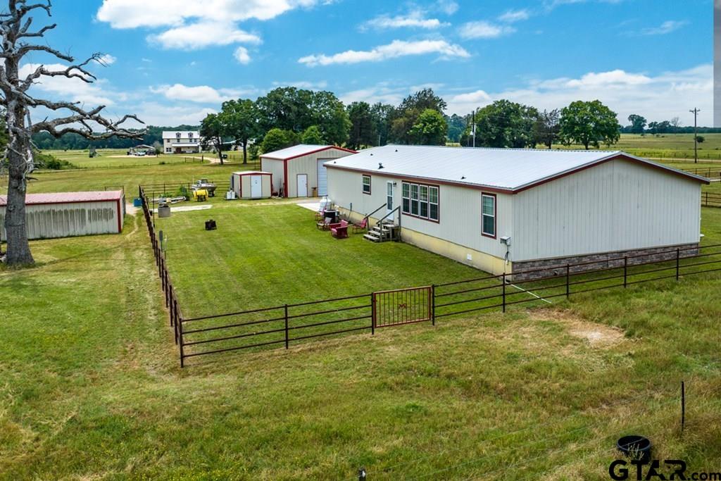 12350 County Road 2911 Eustace, TX 75124 - Photo 39 of 43 a view of a swimming pool with a garden