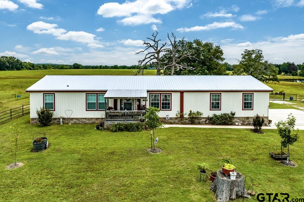 12350 County Road 2911 Eustace, TX 75124 - Photo 5 of 43 a view of a house with backyard porch and sitting area
