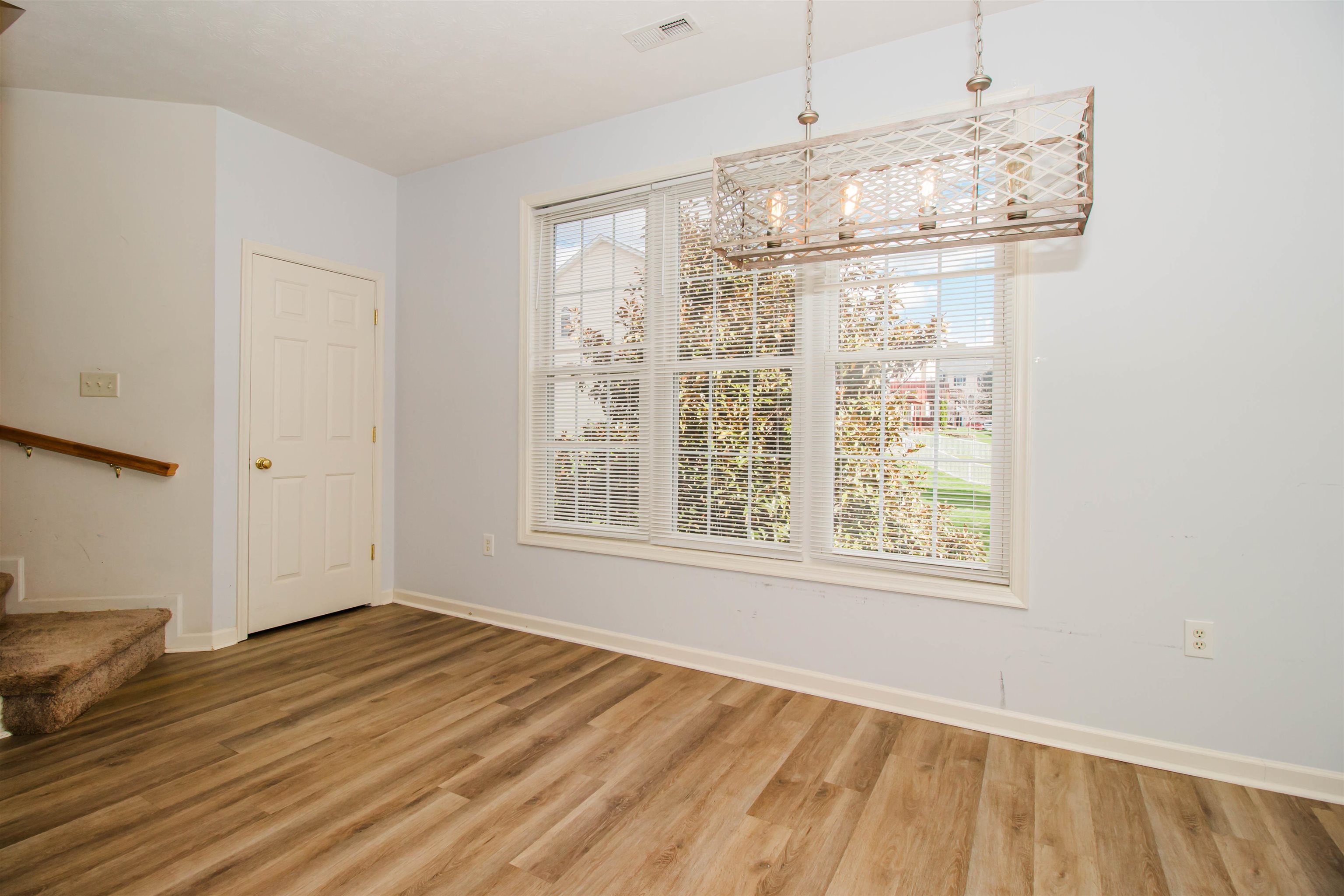 2960 Crystal Spring Lane Harrisonburg, VA 22801 - Photo 11 of 30 an empty room with wooden floor and windows