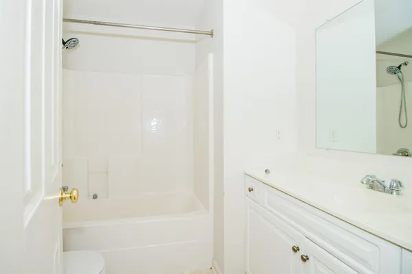 a bathroom with a bathtub and a sink