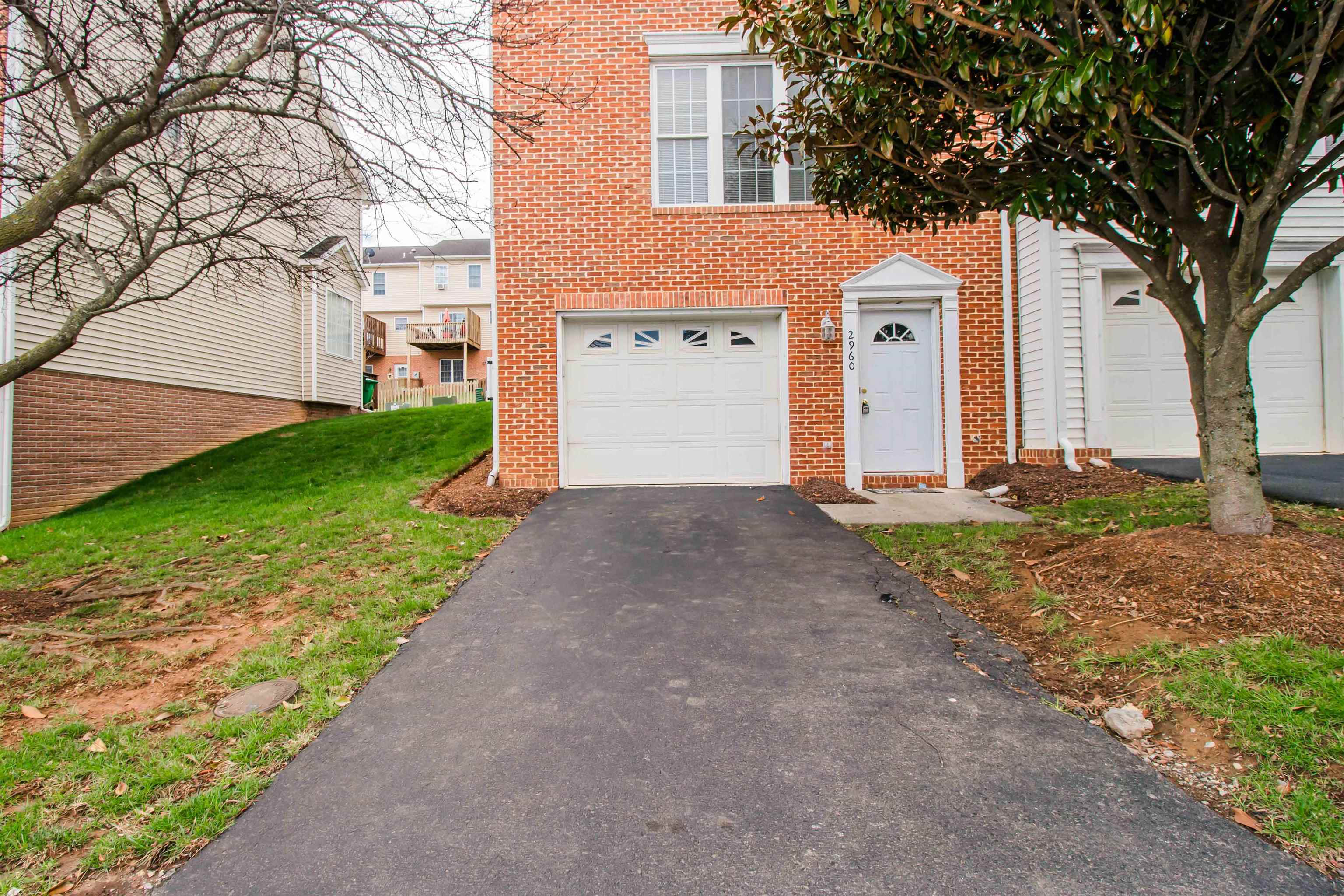 2960 Crystal Spring Lane Harrisonburg, VA 22801 - Photo 26 of 30 a front view of a house with a yard and garage