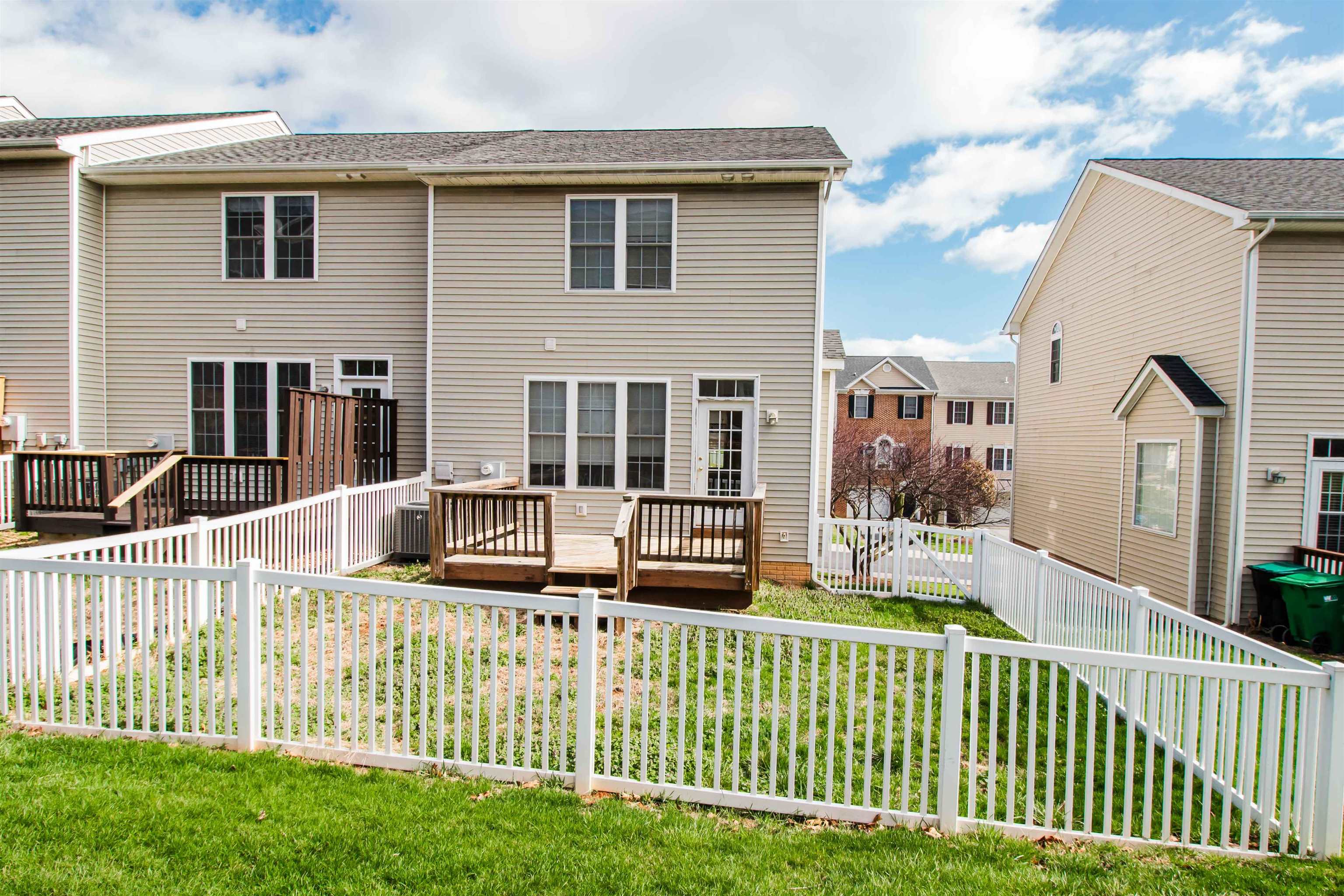 2960 Crystal Spring Lane Harrisonburg, VA 22801 - Photo 27 of 30 a view of a house with a small yard and wooden fence