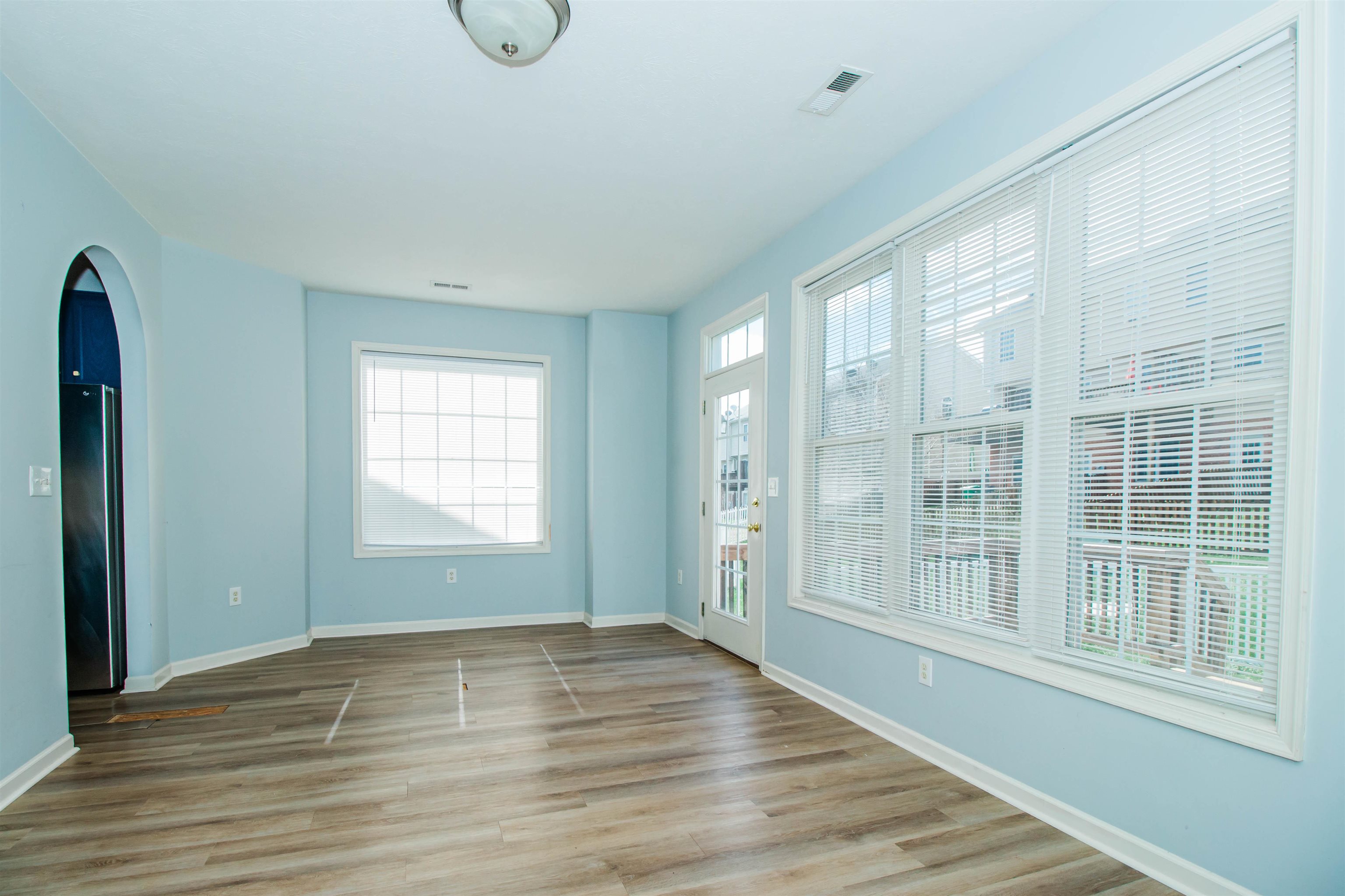 2960 Crystal Spring Lane Harrisonburg, VA 22801 - Photo 7 of 30 a view of empty room with wooden floor and fan