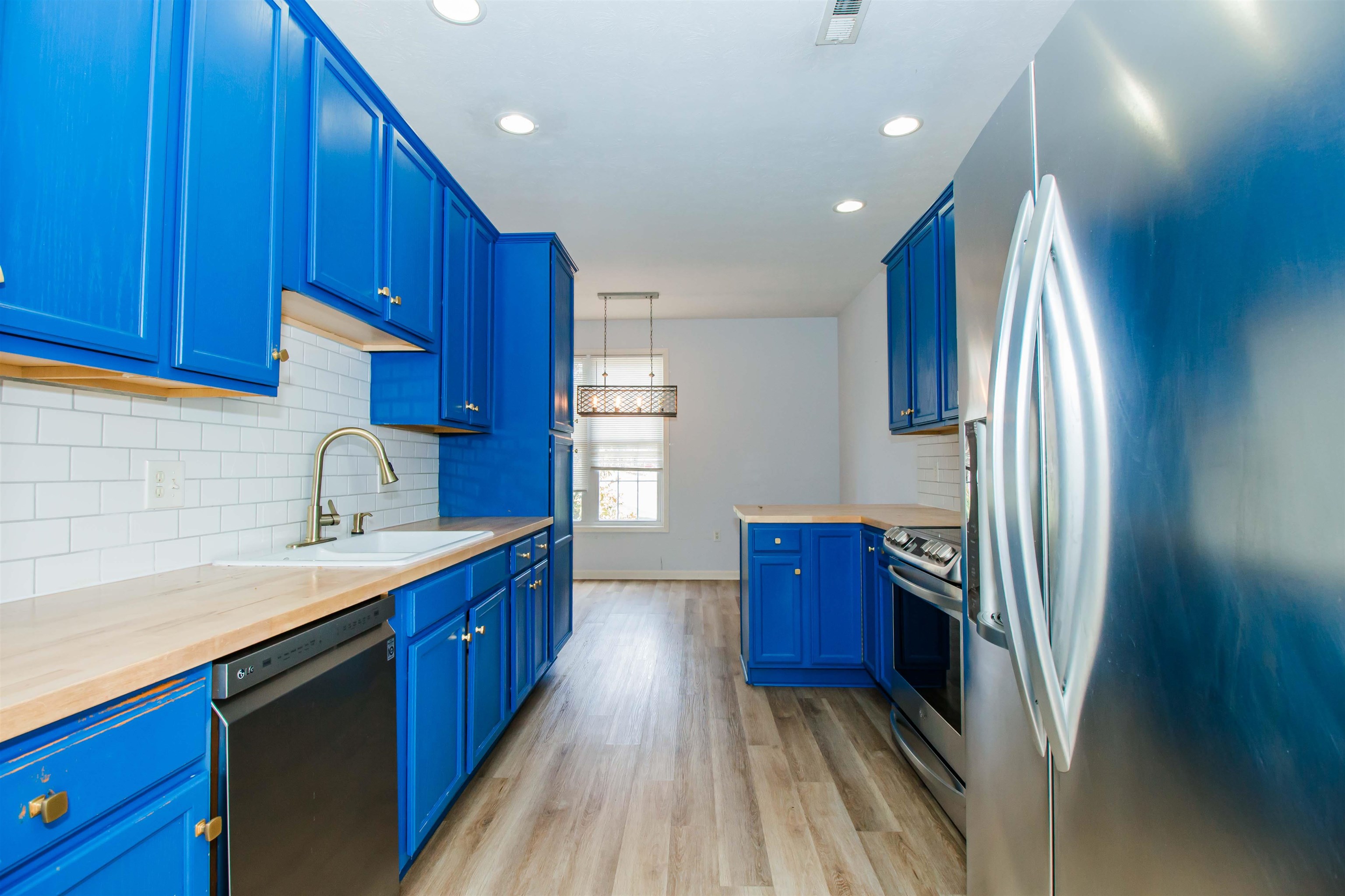 2960 Crystal Spring Lane Harrisonburg, VA 22801 - Photo 9 of 30 a kitchen with stainless steel appliances granite countertop a refrigerator a sink dishwasher and wooden cabinets with a sink