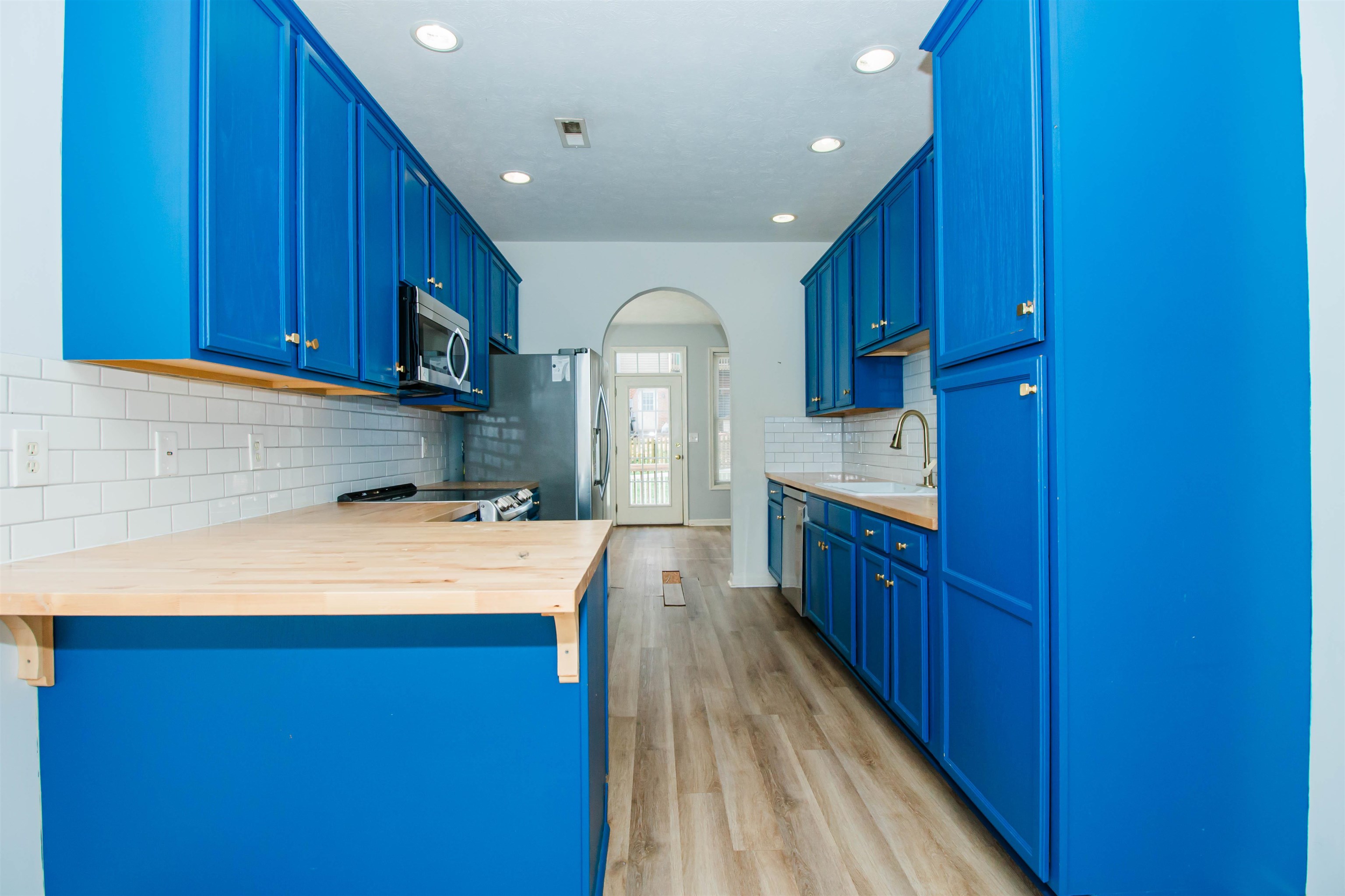 2960 Crystal Spring Lane Harrisonburg, VA 22801 - Photo 10 of 30 a kitchen with wooden cabinets and center island