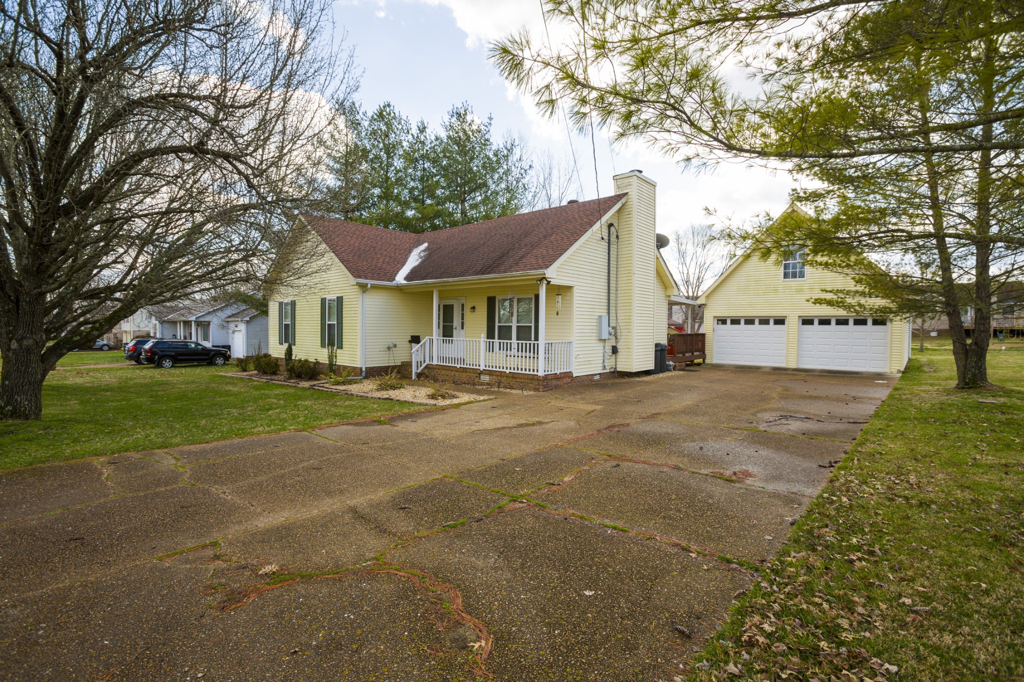 6045 Ebenezer Road Greenbrier, TN 37073 - Photo 2 of 30 a front view of a house with a yard and garage