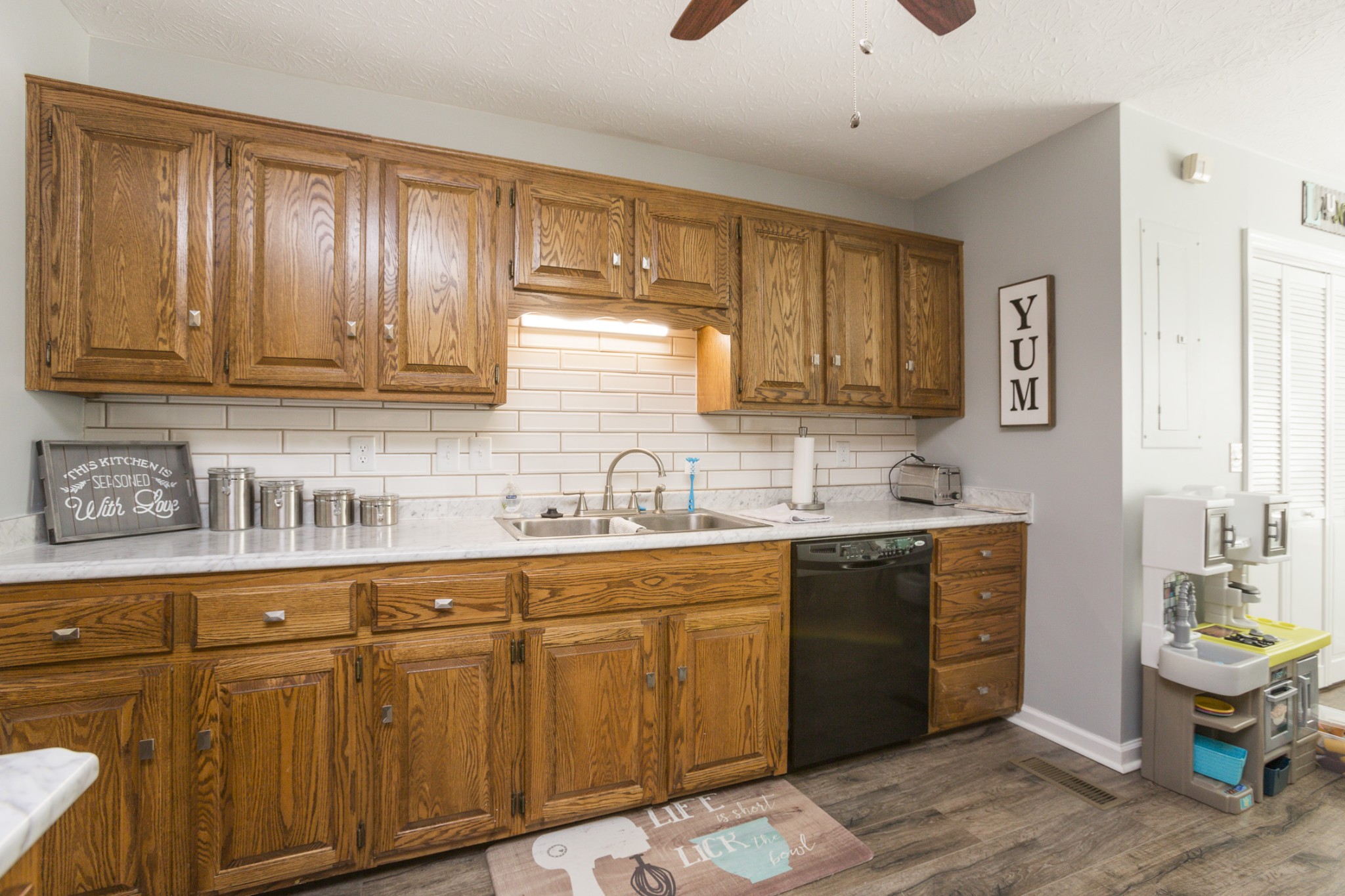6045 Ebenezer Road Greenbrier, TN 37073 - Photo 11 of 30 a kitchen with stainless steel appliances granite countertop a sink dishwasher stove and cabinets