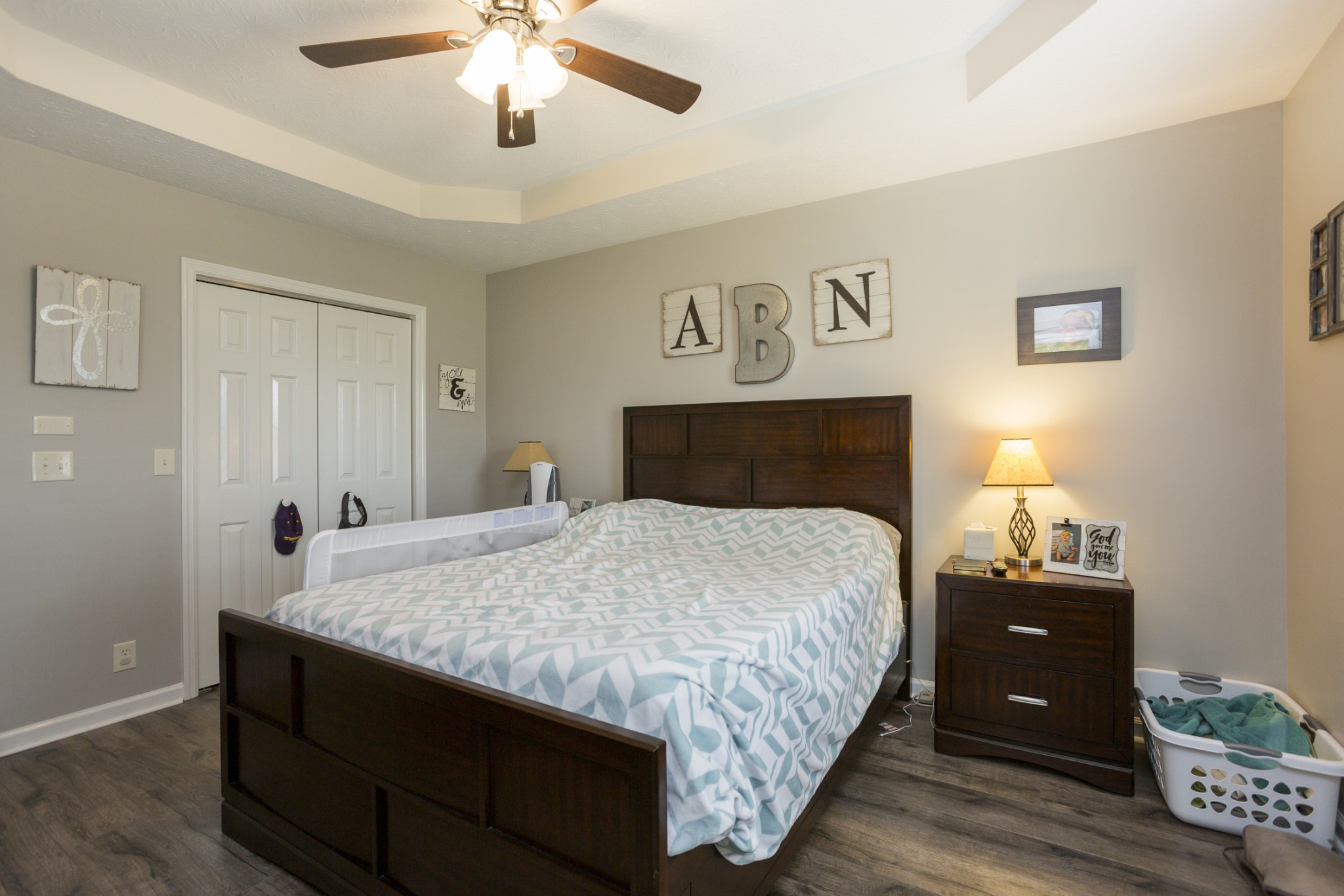 6045 Ebenezer Road Greenbrier, TN 37073 - Photo 17 of 30 a bedroom with bed and wooden floor