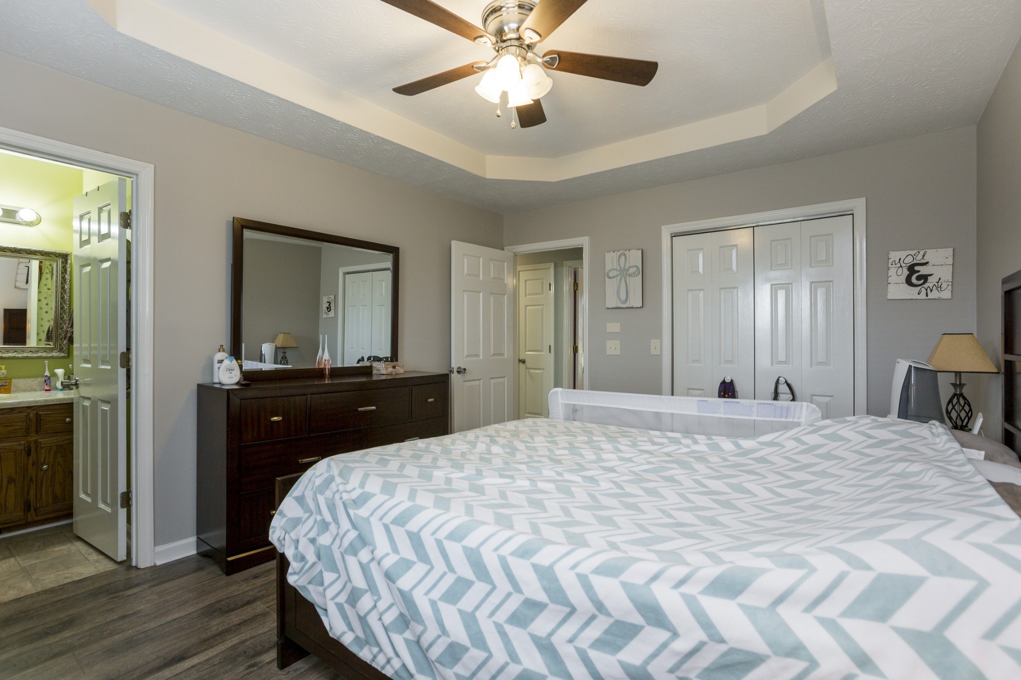 6045 Ebenezer Road Greenbrier, TN 37073 - Photo 18 of 30 a bedroom with a bed and a chandelier