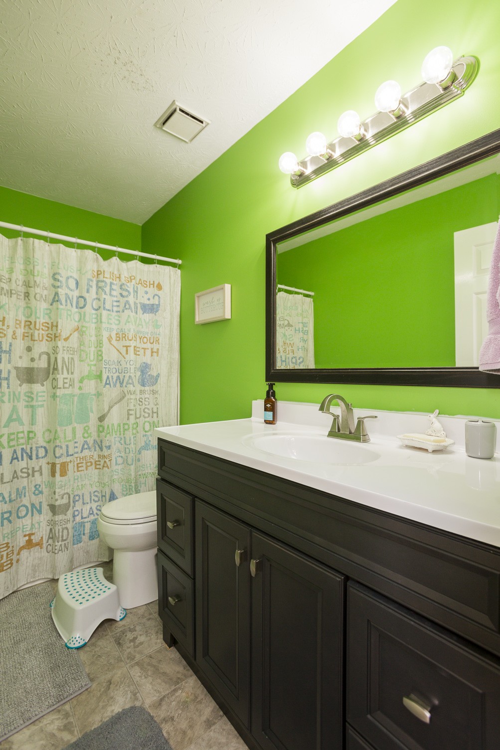 6045 Ebenezer Road Greenbrier, TN 37073 - Photo 22 of 30 a bathroom with a double vanity sink and a mirror